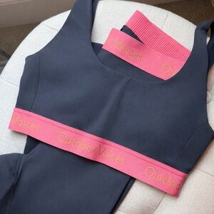 Outdoor Voices Black Sports Bra with Pink Band and Gold Logo